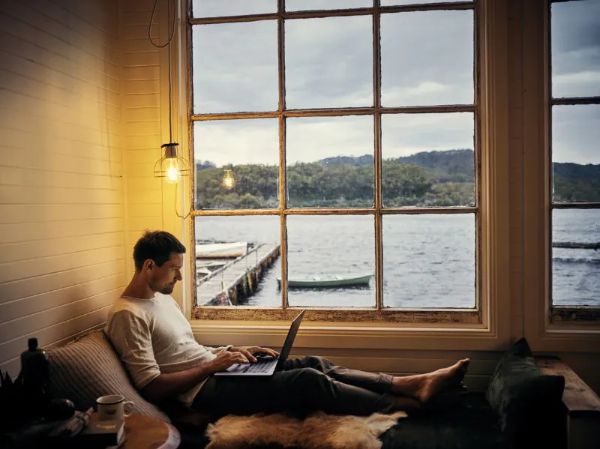a man browsing in his laptop